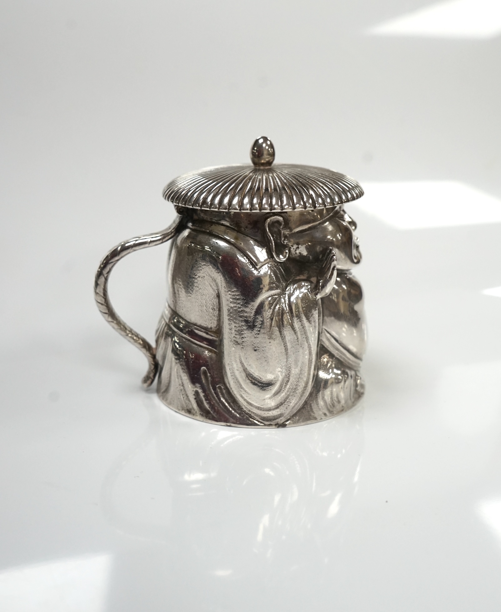 A Victorian novelty silver mustard, modelled as a Chinaman, with blue glass liner, by Richard Sibley II, London, 1847, height 85mm, 6.1oz. Condition - fair